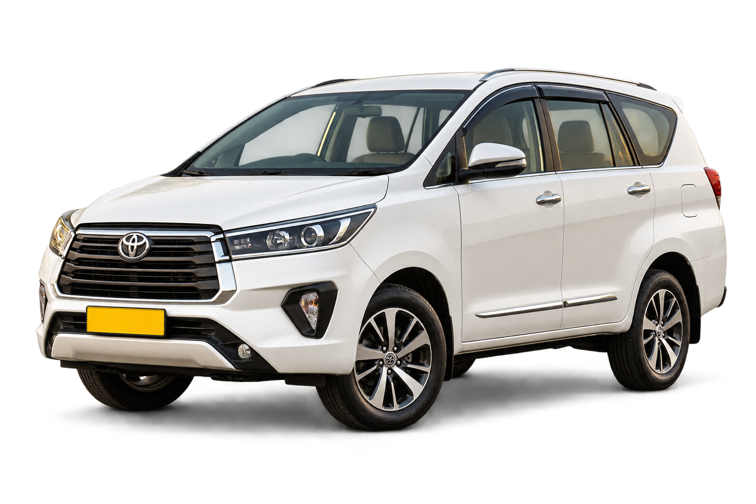 White premium Innova Crysta-style taxi from Madar Tours and Travels
